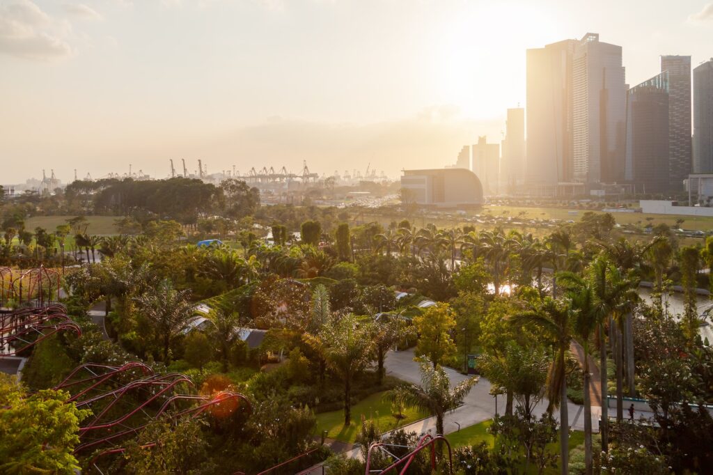 =EDITORIAL= Panorama view of Gardens by the Bay area, modern skyscrapers and sea port of Asian city.
